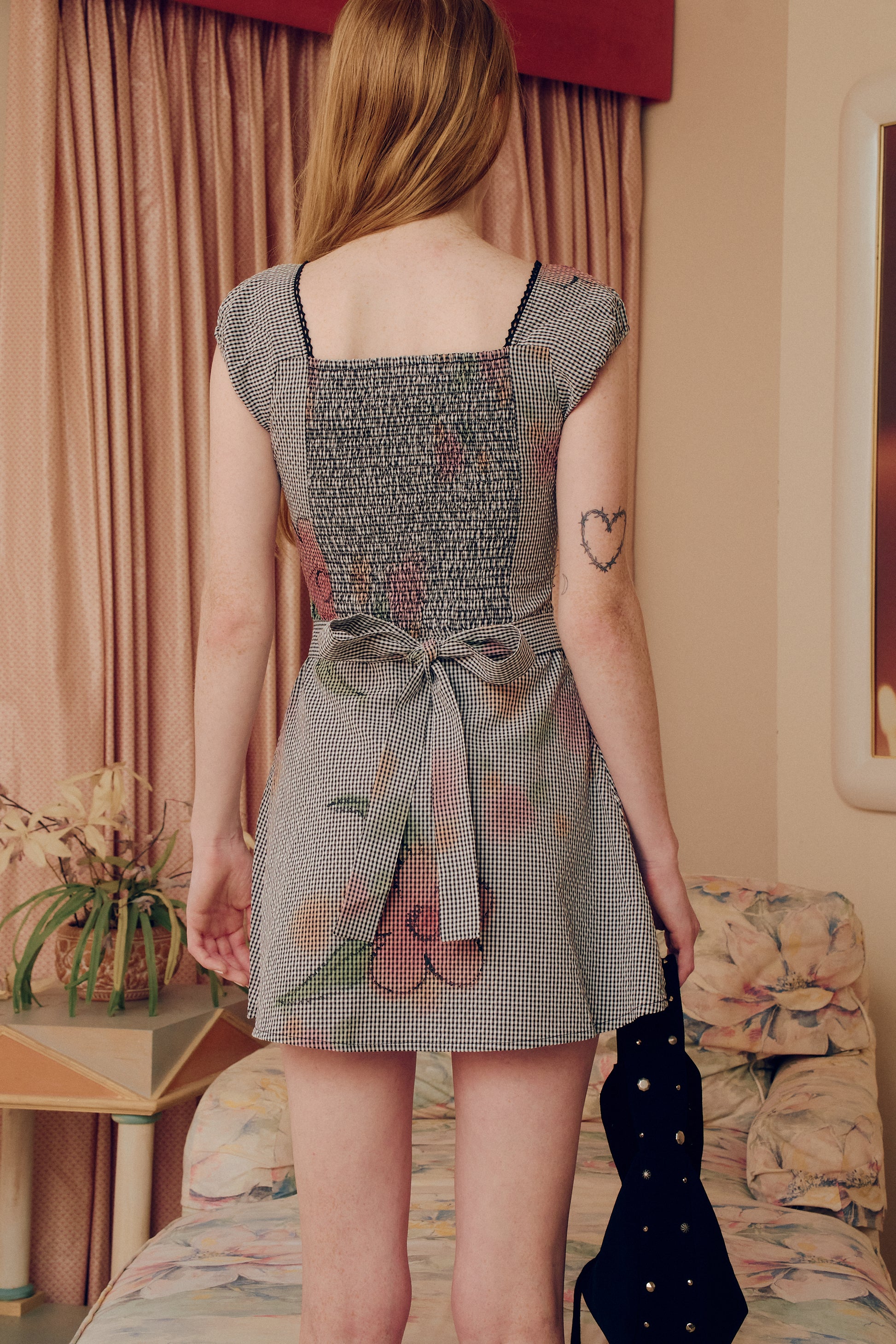 Introducing our Flower Gingham Dress, featuring a timeless gingham pattern and delicate flower embroidery. This dress exudes elegance and sophistication, perfect for any occasion. Made with high-quality materials, it offers both comfort and style. A must-have for any fashion-forward individual.