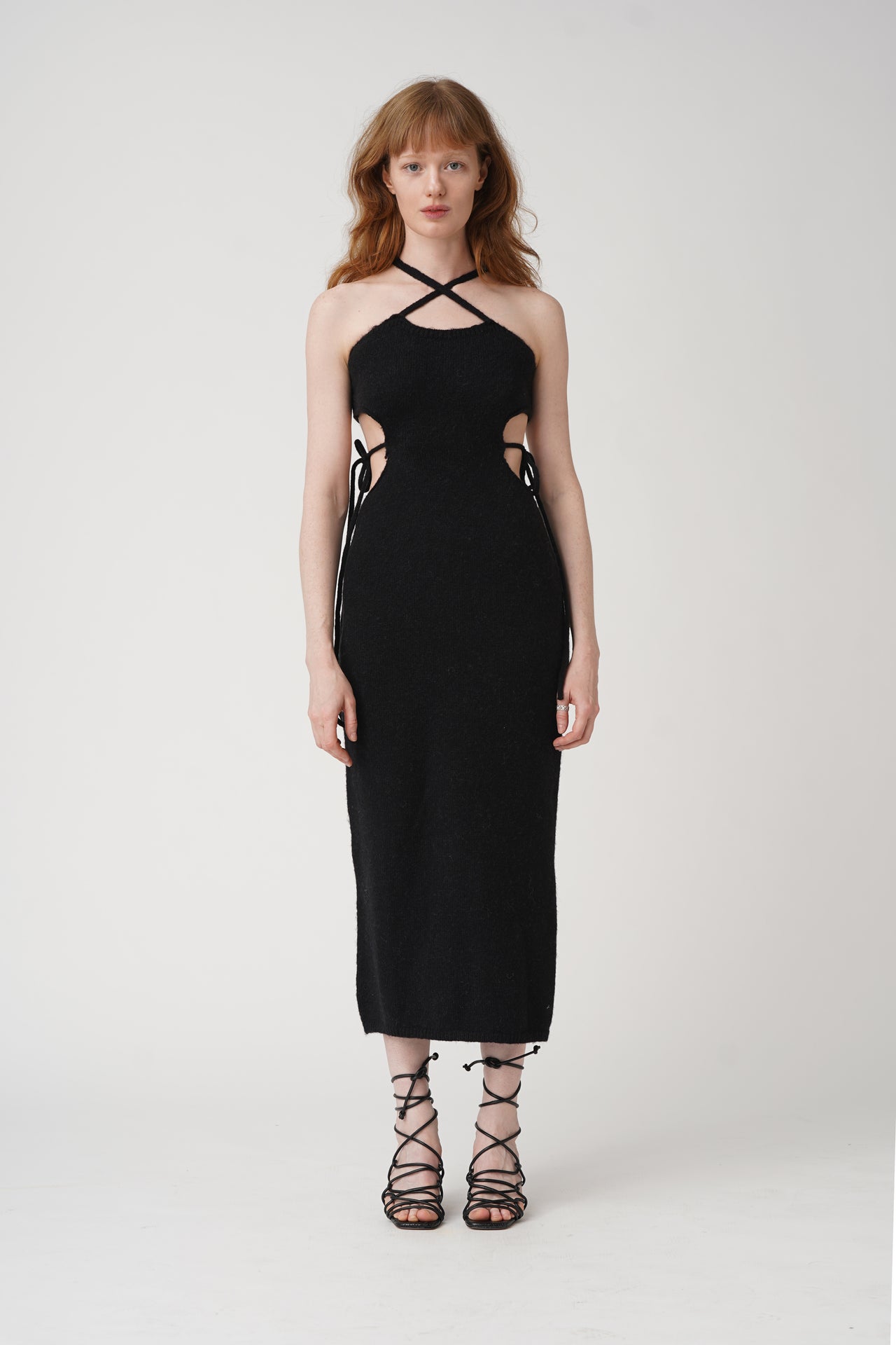 Get tied up in style with our Tie Me Knit Midi Dress! This chic dress will have you looking effortlessly fashionable in a classic black color. Made for the fun and fashionable, this dress is perfect for any occasion.