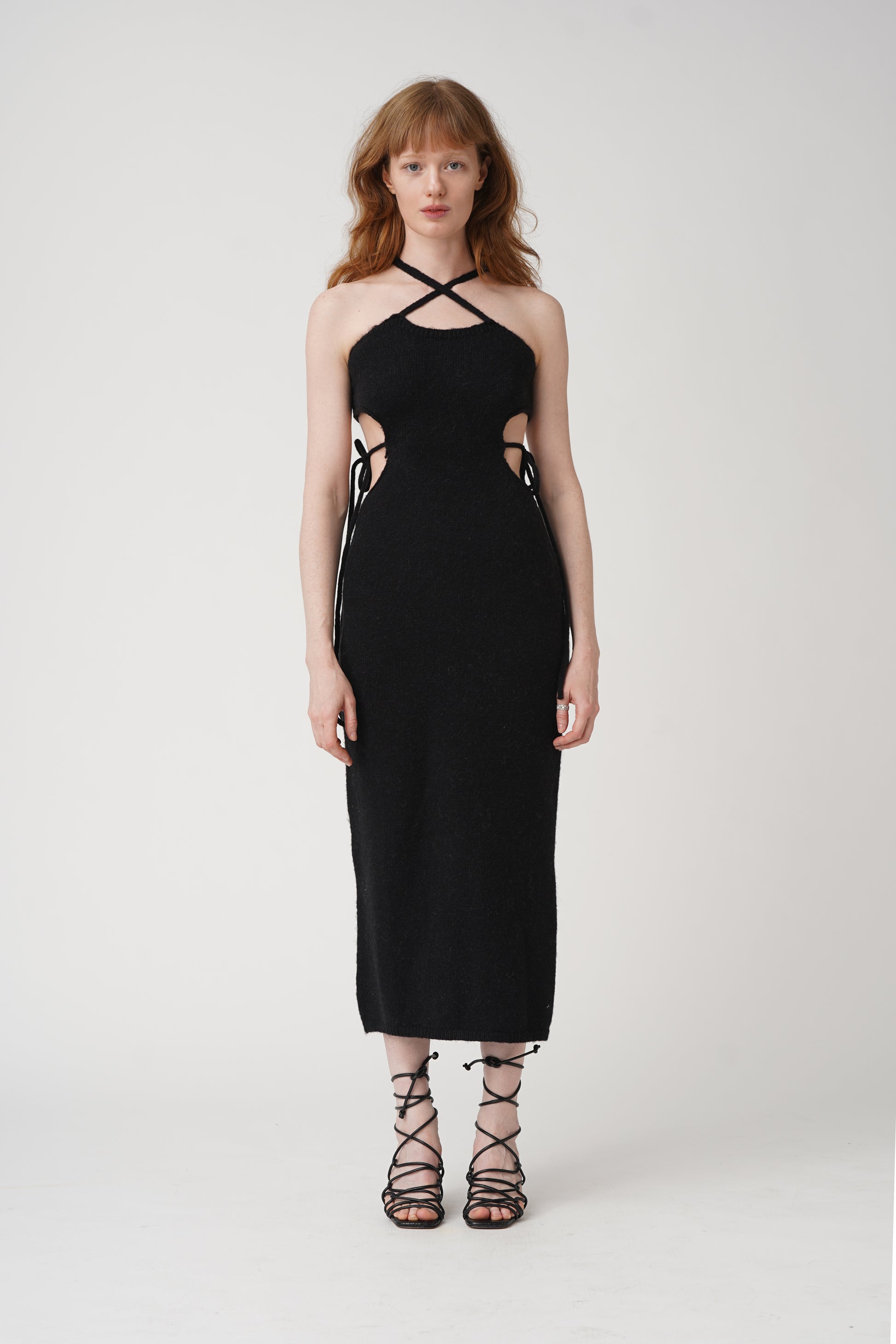 Get tied up in style with our Tie Me Knit Midi Dress! This chic dress will have you looking effortlessly fashionable in a classic black color. Made for the fun and fashionable, this dress is perfect for any occasion.