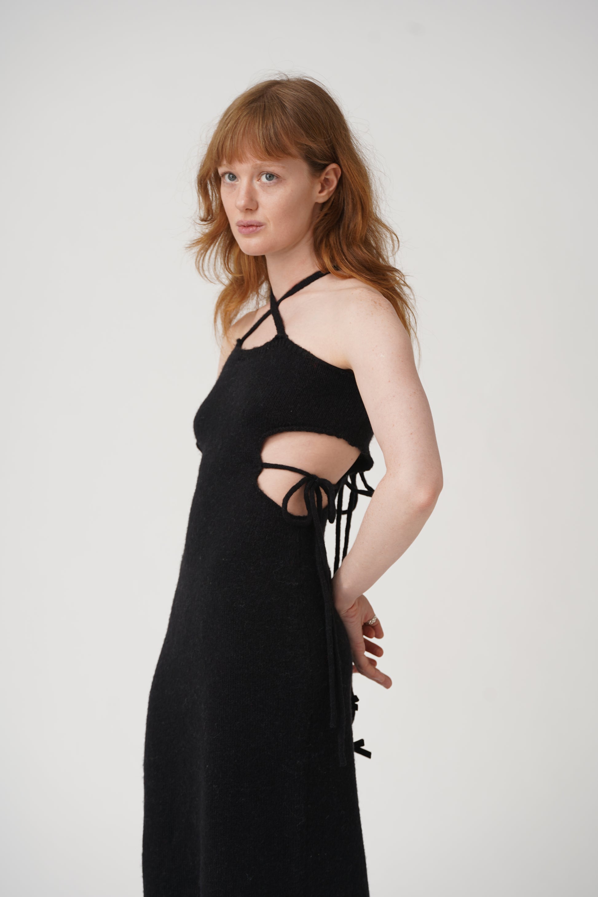 Get tied up in style with our Tie Me Knit Midi Dress! This chic dress will have you looking effortlessly fashionable in a classic black color. Made for the fun and fashionable, this dress is perfect for any occasion.