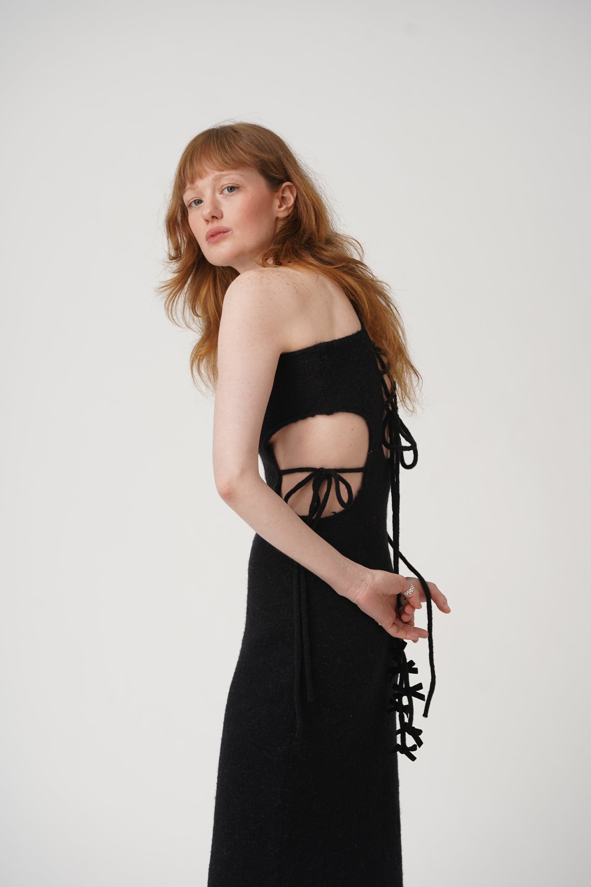 Get tied up in style with our Tie Me Knit Midi Dress! This chic dress will have you looking effortlessly fashionable in a classic black color. Made for the fun and fashionable, this dress is perfect for any occasion.